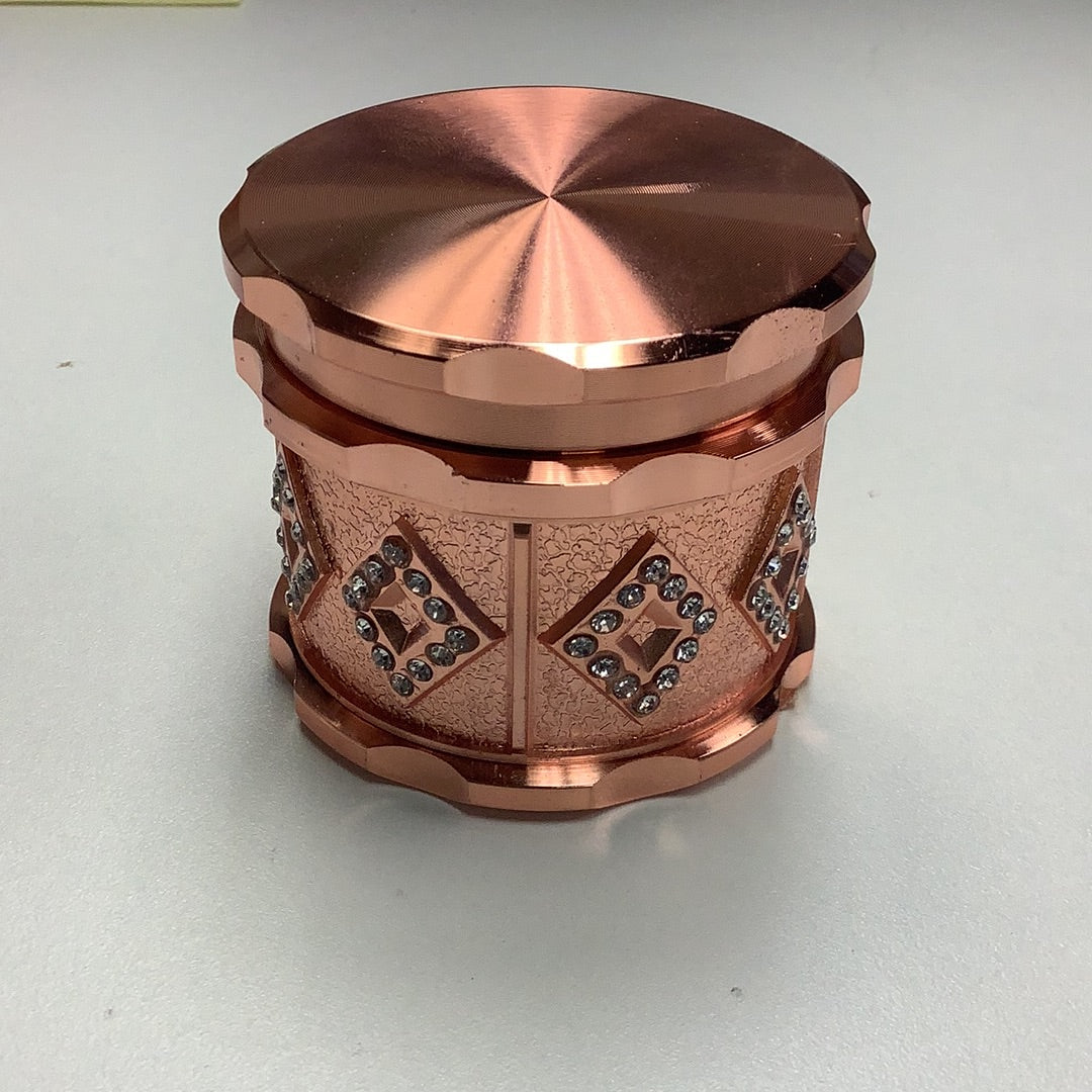 Iced Out Copper Colored Metal Grinder 2 3/8 Inch yoga smokes yoga studio, delivery, delivery near me, yoga smokes smoke shop, find smoke shop, head shop near me, yoga studio, headshop, head shop, local smoke shop, psl, psl smoke shop, smoke shop, smokeshop, yoga, yoga studio, dispensary, local dispensary, smokeshop near me, port saint lucie, florida, port st lucie, lounge, life, highlife, love, stoned, highsociety. Yoga Smokes